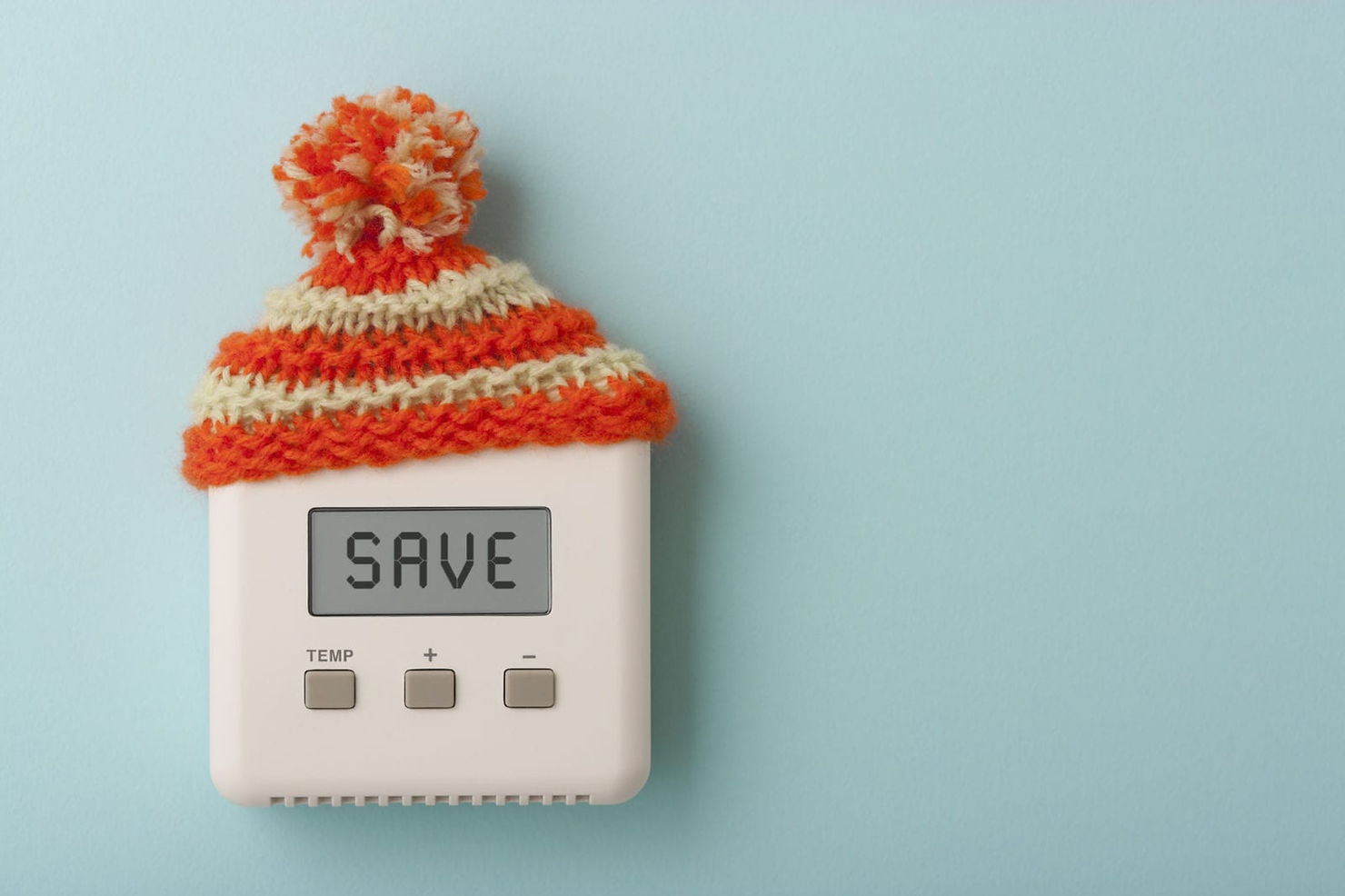 Thermostat with a knitted hat on